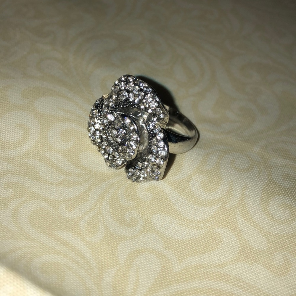 Silver tone rose ring with rhinestones.